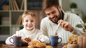 father spending Christmas time with his children at home, holiday co-parenting tips for separated fathers
