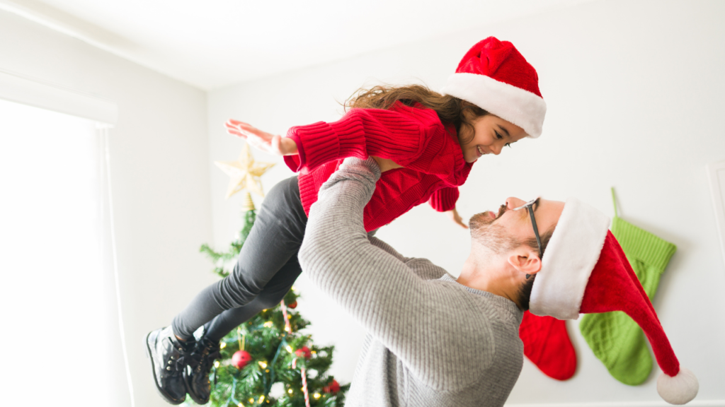 father spending Christmas time with his children at home